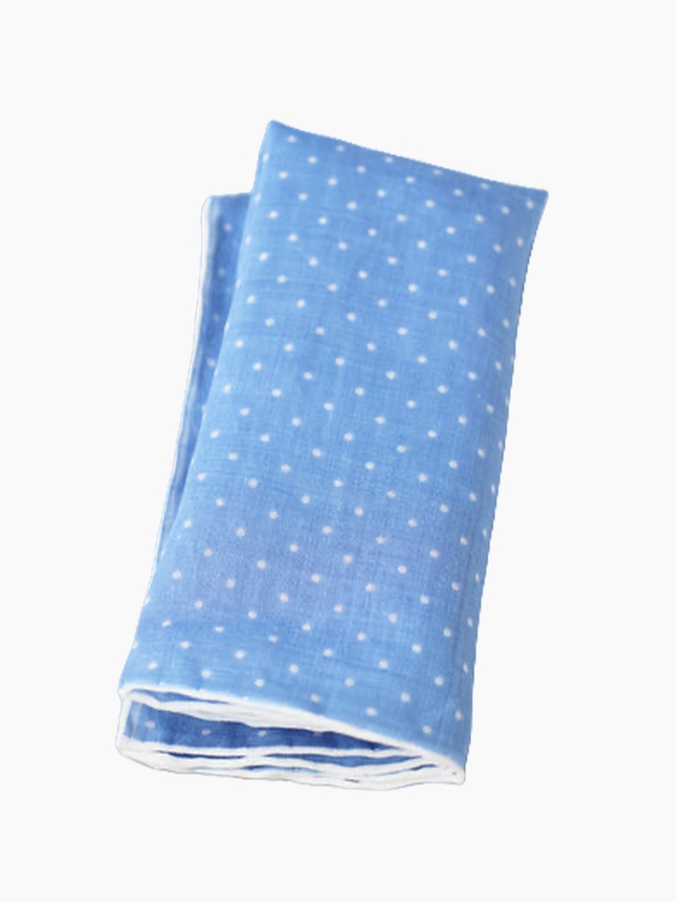 A blue linen pocket square with white dots.