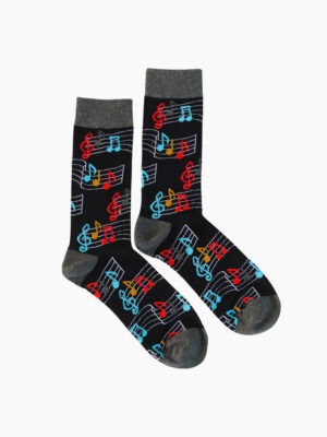 A pair of black socks adorned with colorful musical notes, featuring gray cuffs and toes.