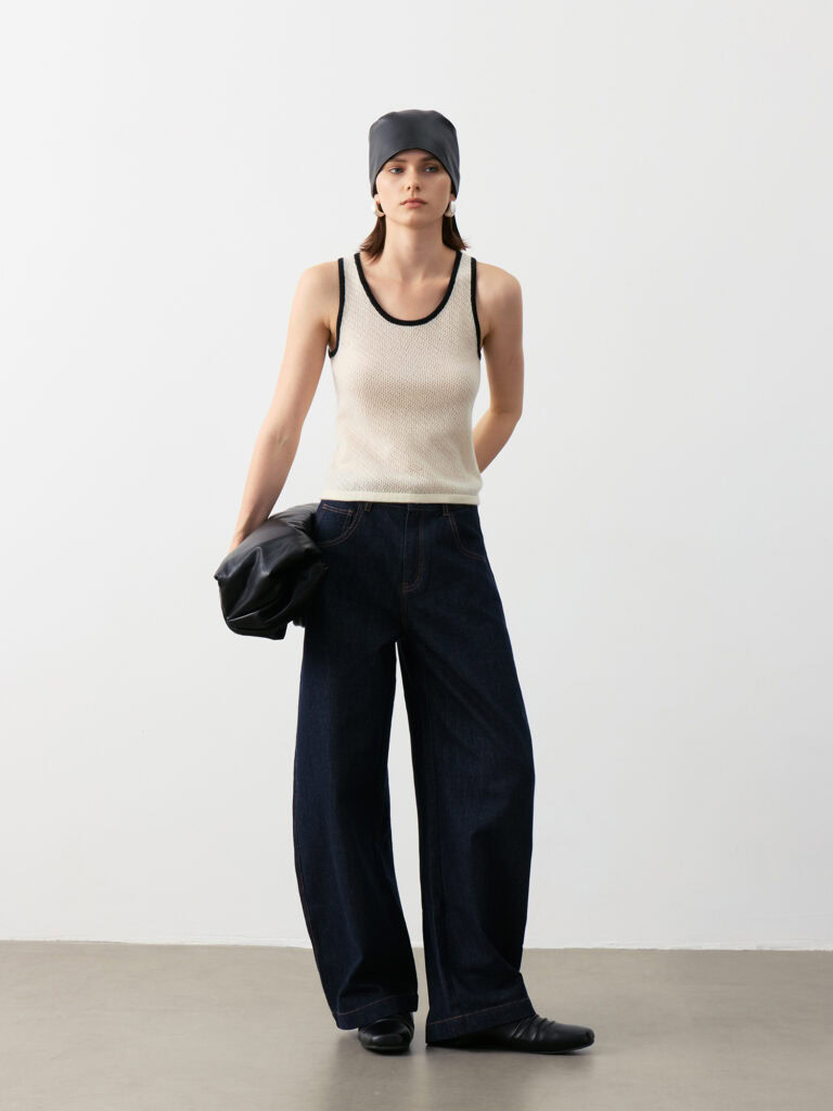 Luxury Rebel Cashmere Tank Top Outfit | Ivory with Contrast Trim (Black/Ivory) Paired with Dark Denim Jeans, Black Bag & Grey Headscarf - Edgy Luxury