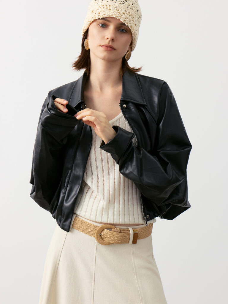 Close-up of 100% Cashmere V-Neck Ribbed Camisole in Ivory White, Showcasing Strap and Ribbed Texture