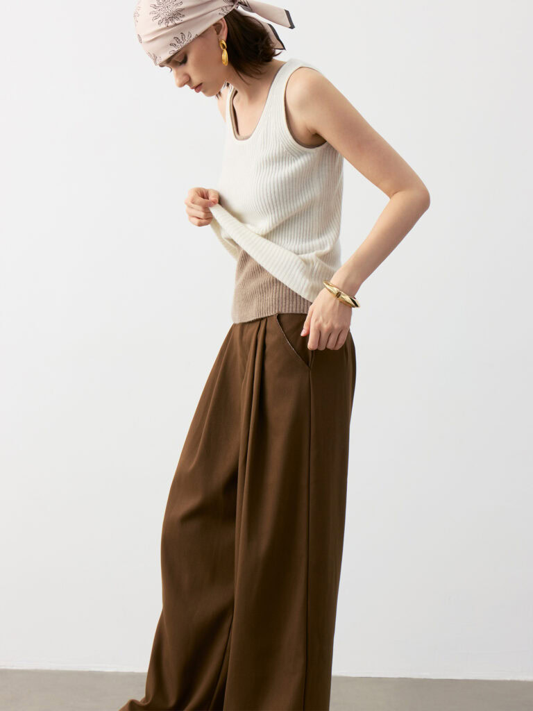 Model Wearing 100% Cashmere U-Neck Ribbed Camisole in Ivory White & Taupe Brown with Brown Wide-Leg Pants and Headscarf